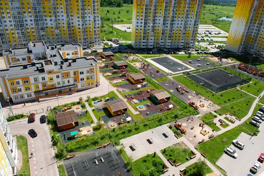 bird's-eye view of school grounds and playground inside a residential apartment complex