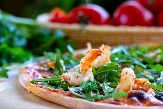 Delicious rustic Italian pizza with grilled Adriatic shrimps, mozzarella, sun dried tomatoes, arugula and parmesan cheese.