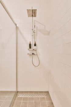 Interior of the cozy shower cabinet with silver tools