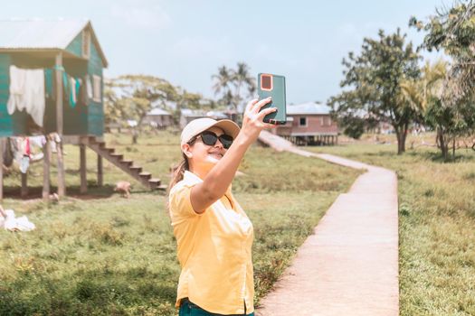 Latin woman taking a selfie in an Afro-descendant indigenous community on the Caribbean coast of Nicaragua
