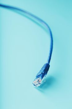 Blue UTP Internet Cable - Isolated on a blue background Ethernet Cord