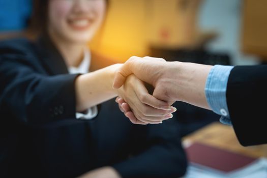 Business partnership meeting concept. Image business woman handshake. Successful business people handshaking after good deal. Group support concept