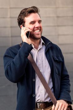 portrait of a smiling caucasian businessman talking on the phone, concept of entrepreneurship and business