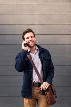 smiling caucasian businessman talking on the phone, concept of entrepreneurship and business, copy space for text