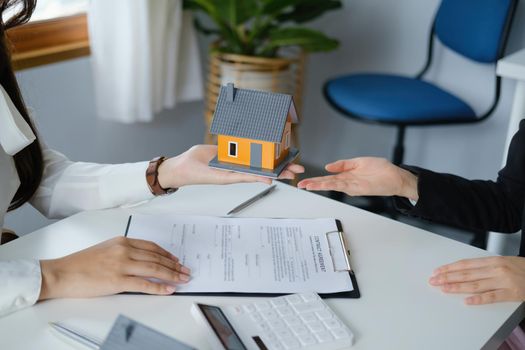 Guarantee, mortgage, agreement, contract, sign, real estate agent delivers the house to the customer after signing important contract documents.