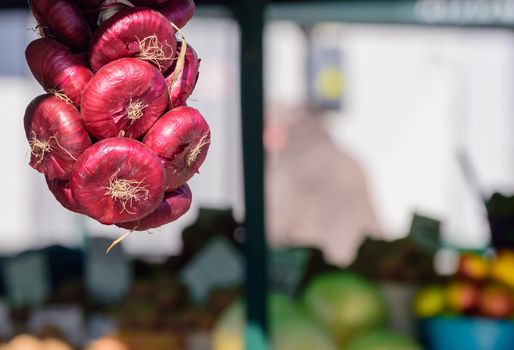 Big red onion for sale at the market, background.