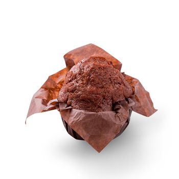 Delicious chocolate muffin on white background. Fresh chocolate cakes in decorative paper. Copy space to place text, close up