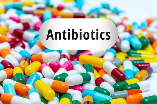 Pile of multi-colored antibiotics capsule pills. Antibiotic drug resistance concept. Prescription drugs. Superbug concept. Antibiotic drug use with reasonable. Pharmacology of antimicrobial drugs.