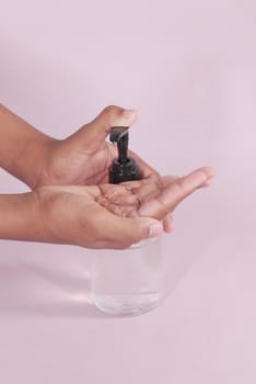 close up of young man hand using sanitizer gel for preventing virus.