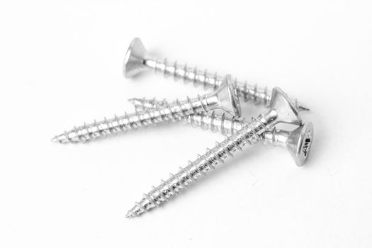 Macro photography of screws on white background
