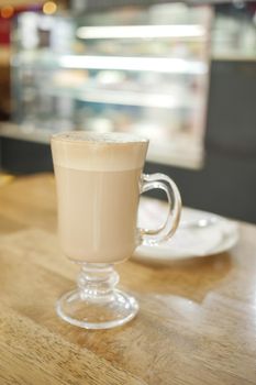 a cup of late coffee on cafe table ,