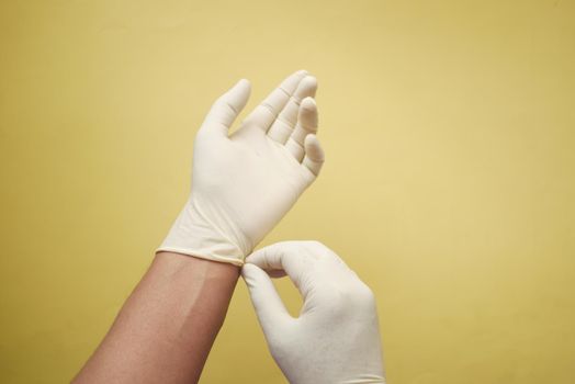 man doctor wears medical gloves.