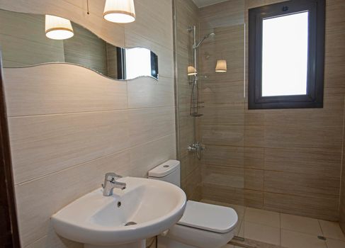 Interior design of a luxury show home bathroom with shower cubicle toilet and sink