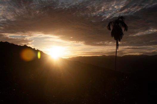 Sunset view with mountain and hill background. Nature beauty and copy space.