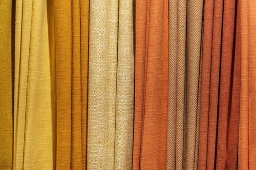 Background Texture Of A Selection Of Multiple Different Warm-Colored Fabric Samples