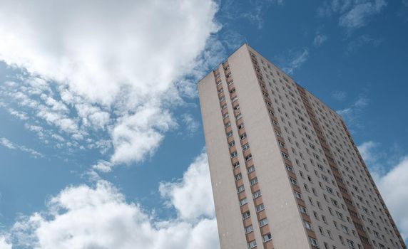 A Council Estate Tower Block In Glasgow, Scotland, UK, Against A Bright Blue Sky