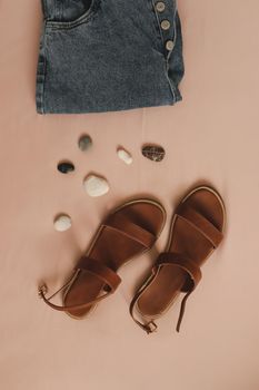 Summer fashion, vacation on sea concept. flat lay composition with sandals and denim shorts top view.