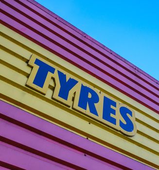 Garish Sign For Tyres (Tires) At A Garage Or Service Station