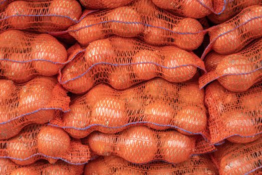 Abstract Background Texture Of Sacks Of Onions At A Market