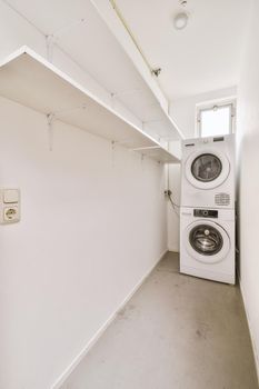 Empty shelves and washing machines in the empty room