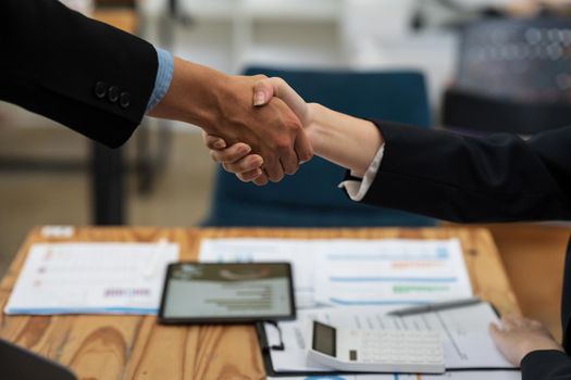 Business partnership meeting concept. Image business woman handshake. Successful business people handshaking after good deal. Group support concept