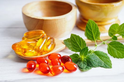 Alternative medicine herbal organic capsule with vitamin E omega 3 fish oil, mineral, drug with herbs leaf natural supplements for healthy good life.