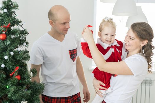 Father with toddler daughter with cochlear implants having fun in living room health care and innovating treatment for deafness with cochlear implant surgery