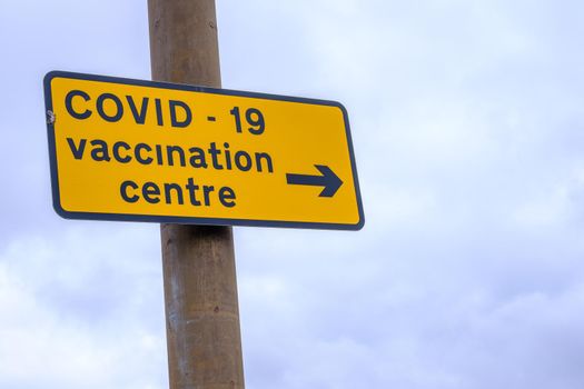 A Sign For A Covid Vaccination Centre With Copy Space