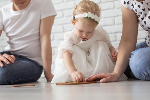 Mother holds her child with hearing aids and cochlear implants . Deaf and health