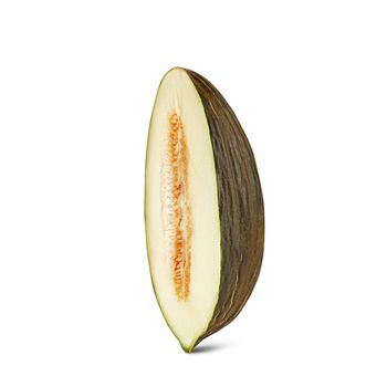 Half of a tasty, mellow, green tendral melon in a cross-section, isolated on white background with copy space for text or images. Sweet flesh with seeds. Pumpkin plant family. Side view. Close-up shot.