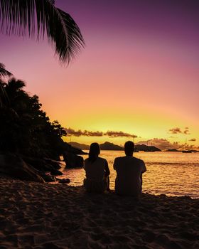 Anse Patates beach, La Digue Island, Seyshelles, Drone aerial view of La Digue Seychelles bird eye view.of tropical Island. mature couple men and women on vacation in Seychelles