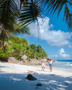 Anse Patates beach, La Digue Island, Seyshelles, Drone aerial view of La Digue Seychelles bird eye view.of tropical Island. mature couple men and women on vacation in Seychelles