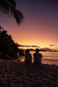 Anse Patates beach, La Digue Island, Seyshelles, Drone aerial view of La Digue Seychelles bird eye view.of tropical Island. mature couple men and women on vacation in Seychelles