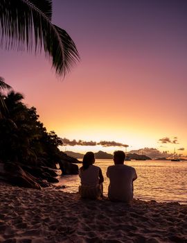 Anse Patates beach, La Digue Island, Seyshelles, Drone aerial view of La Digue Seychelles bird eye view.of tropical Island. mature couple men and women on vacation in Seychelles