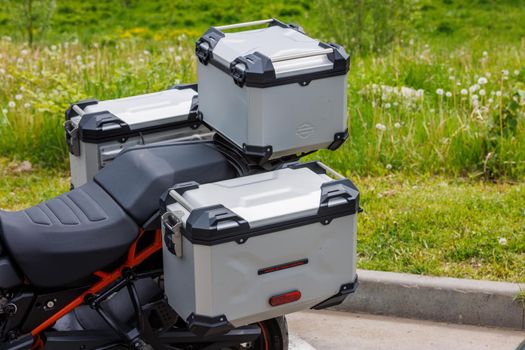 original side and top aluminium cases of Harley-Davidson motorcycle at summer day light in Tula, Russia - June 5, 2022
