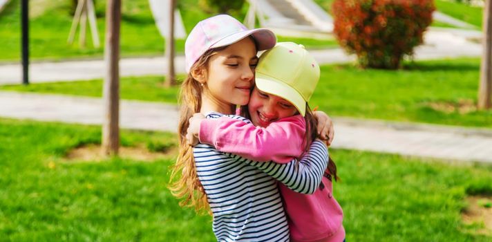 girlfriends children hugging in the park.selective focus.kids