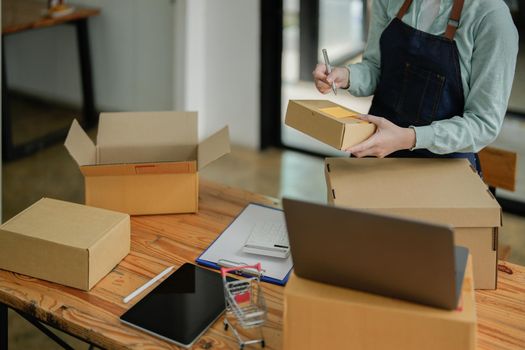 Shipping shopping online small business woman entrepreneur SME or freelance working form home