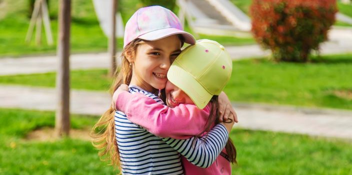 girlfriends children hugging in the park.selective focus.kids