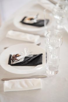 Table set for an event party or wedding reception. Empty wine glasses at a wedding celebration.