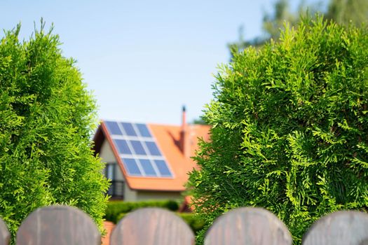 House roof with photovoltaic modules. Historic farm house with modern solar panels on roof and wall High quality photo