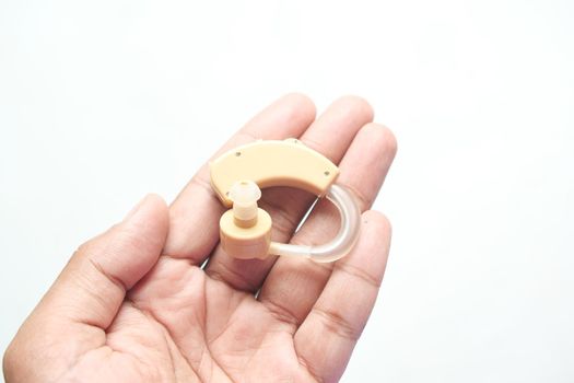 Hearing aid equipment on hand top view ,