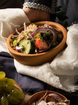 A vertical picture of a dish in hands