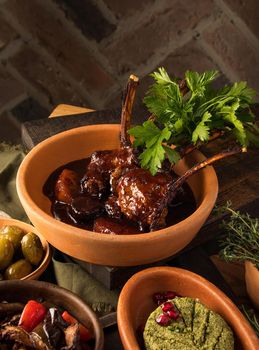 A vertical shot of a tasty appetizers and tomahawk steak