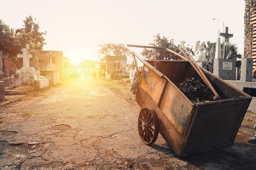 Moody photo of a garbage cart in a cemetery in managua nicaragua