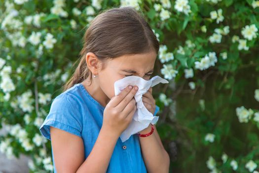The child is allergic to flowers. Selective focus. Kid.