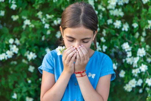 The child is allergic to flowers. Selective focus. Kid.