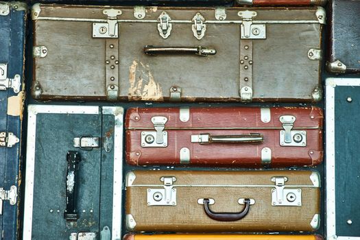 Suitcases for travel. Multicoloured suitcases for clothes. Background. Texture.