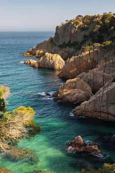 Beautiful turquoise water in Costa Brava in Catalonia of Spain in the sunset light.