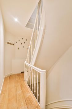 Hallway access to the white wooden stairs