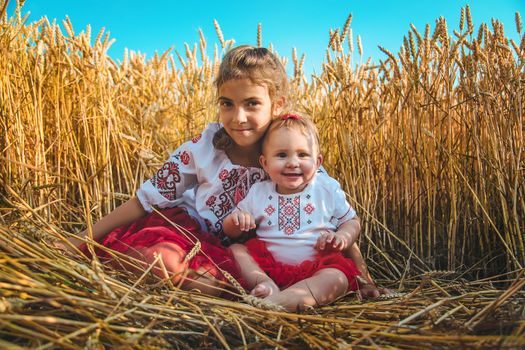 Child in a wheat field. In vyshyvanka, the concept of the Independence Day of Ukraine. Selective focus. Kid.